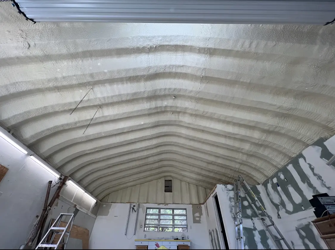 Spray polyurethane foam applied to the underside of a metal roof deck in East Peoria